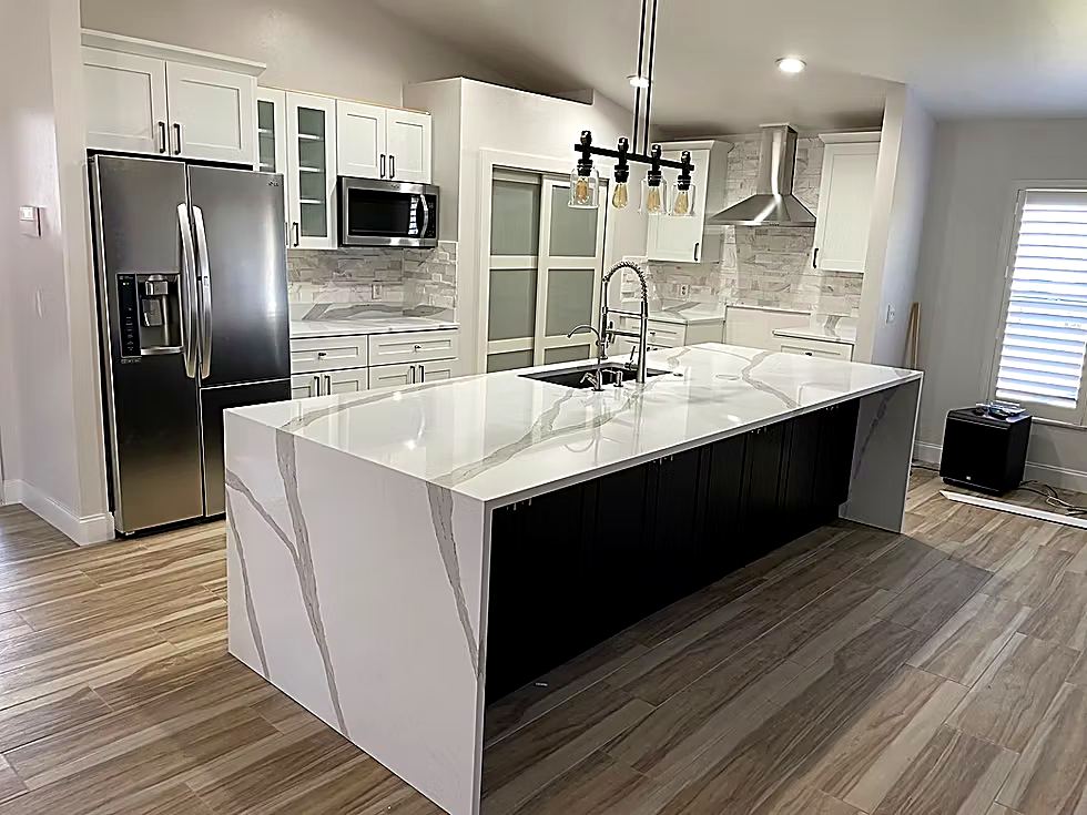 White quartz countertop with grey marble veining and undermount sink